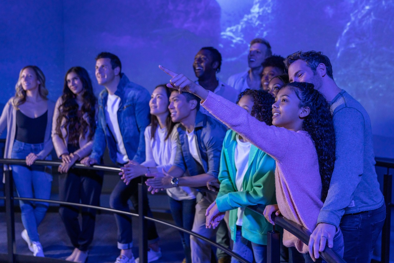 A FlyOver Iceland worker welcomes visitors inside the building.